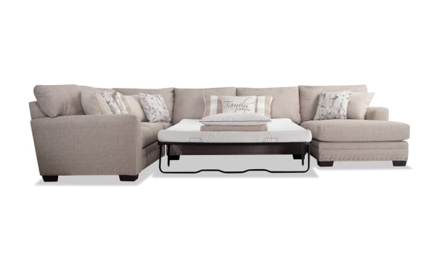 Cottage Chic Beige 150" 4-piece right arm facing sleeper chaise sectional with queen gel mattress, beige polyester fabric, traditional style, nailhead trim, includes 10+ accent pillows with floral and plaid patterns, memory foam gel mattress with stretch knit cover for comfort and durability.
