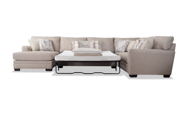 Cottage Chic Beige 4-piece left arm facing sleeper chaise sectional with queen Bob-O-Pedic gel memory foam mattress, polyester fabric, nailhead trim, and multiple accent pillows.