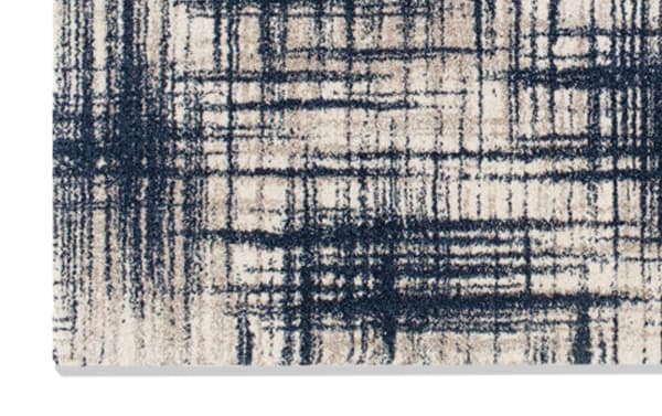 Contemporary Aniston 5' x 8' Blue Abstract Rug in navy, gray, and cream with a soft, durable polypropylene fabric and abstract pattern.