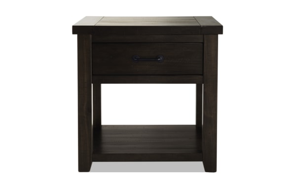Montana Brown Storage End Table from Montana Entertainment & Occasional, rustic wood with distressed brown finish, black hardware, wire-brushed top, and lower shelf for storage.