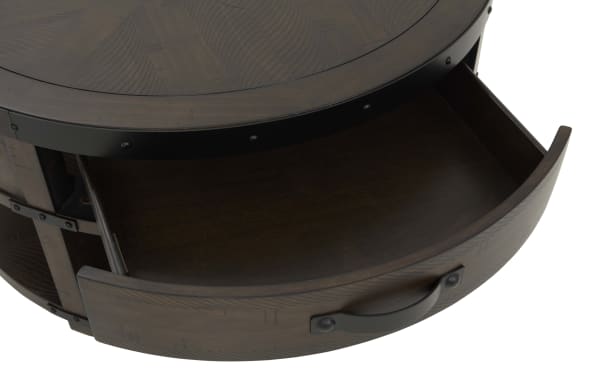 Round dark wood side table drawer open, featuring metal handle and decorative wood grain pattern, suitable for living room storage.