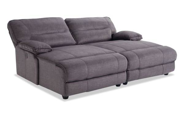 Pacifica Gray 82" power reclining dual chaise sofa in gray polyester fabric with plush cushions and transitional style, featuring memory foam comfort and button control.