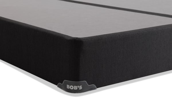 Distinction Split Standard King Foundation Set by Bob's, featuring black fabric upholstery and protective corner guards for mattress support.