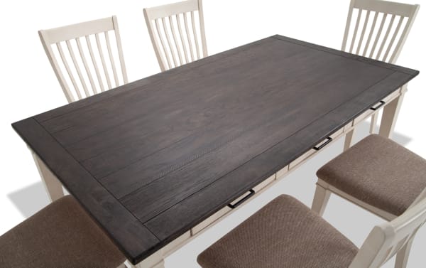 Montana 7 Piece White & Beige Upholstered Dining Set with rustic rubberwood and oak veneer table, six storage drawers, and beige polyester fabric chairs with memory foam cushions.