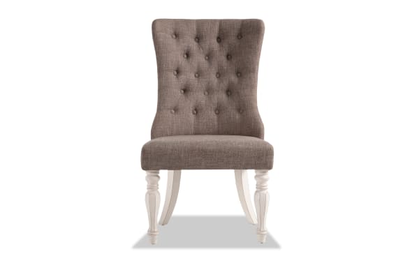 Scarlett White & Beige Solid Back Upholstered Dining Chair with tufted beige polyester fabric, carved white distressed legs, cottage style.