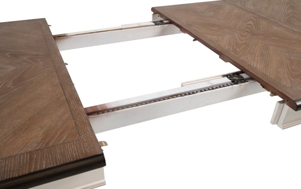 Scarlett White & Oak Extendable Dining Table from Scarlett Dining Collection, cottage style with wire brushed oak veneer top, carved legs, and antique white MDF frame, shown extended with two 18" leaves for extra seating.
