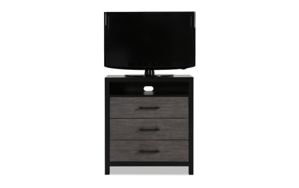 Fusion Black & Gray 3 Drawer TV Chest from Fusion collection, featuring transitional style with black MDF frame, gray birch veneer drawers, bar handle hardware, felt-lined drawers, and cord management opening for organized media setup.