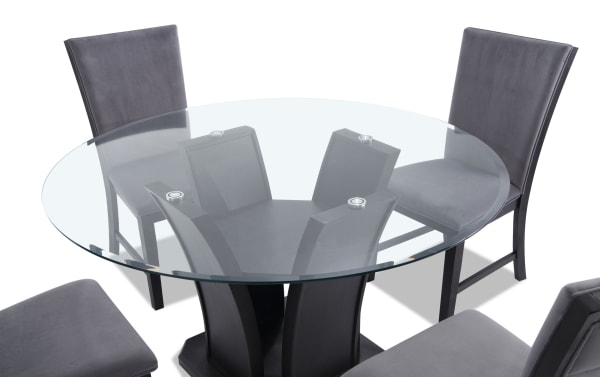 Cosmopolitan 5 Piece Black & Gray Upholstered Round Dining Set with tempered glass tulip table, velvet gray fabric chairs, and espresso wood legs.