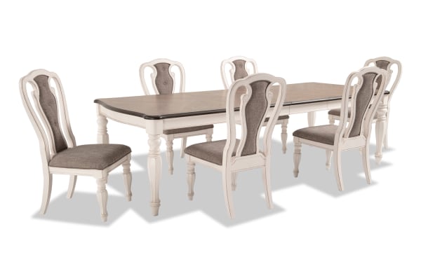 Scarlett 7 Piece Beige Upholstered Extendable Dining Set with wire brushed oak top, antique white carved legs, and tufted fabric splat back chairs.