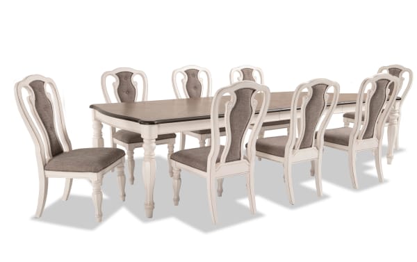Scarlett 9 Piece White & Beige Upholstered Extendable Dining Set with wire brushed oak top, carved legs, antique white finish, and tufted fabric chairs.