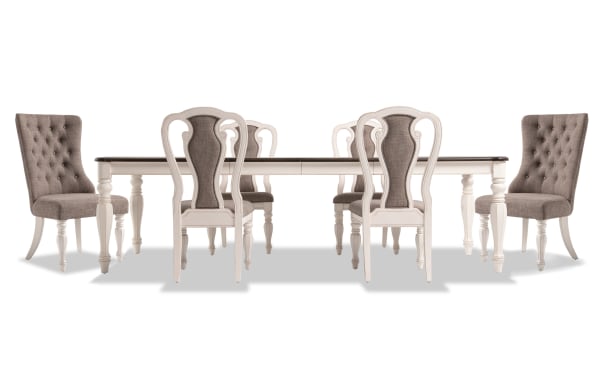 Scarlett 7 Piece Cottage Dining Set with extendable wire brushed oak top, distressed white legs, beige polyester upholstery, tufted backs, and memory foam seats.