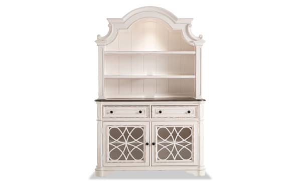 Scarlett 2 Piece White & Oak China Cabinet from Scarlett Dining collection, cottage style with MDF, poplar solids, oak veneers, distressed white finish, antique brass hardware, decorative glass doors, two drawers, and open shelves with touch lighting.