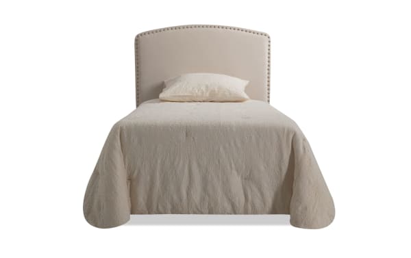 Beige transitional Isabella Twin Upholstered Panel Headboard with arched top, individual nailhead trim, and soft polyester fabric upholstery.