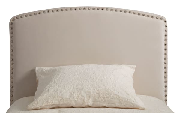 Beige Isabella Twin Upholstered Panel Headboard with arched design, polyester fabric, and individual nailhead trim in transitional style.