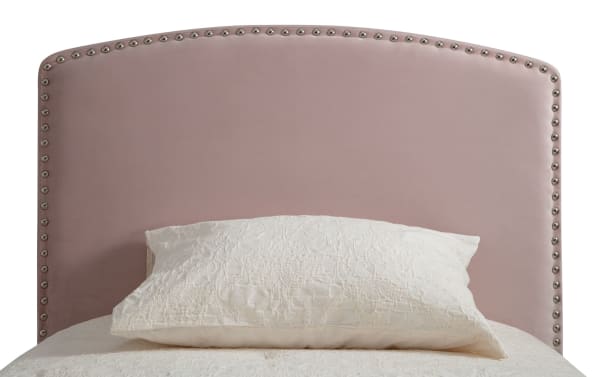 Isabella Twin Pink Upholstered Panel Headboard in transitional style, featuring soft pink polyester fabric and arched design with silver nailhead trim.