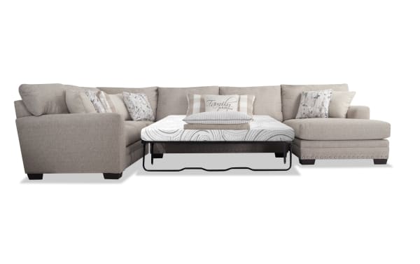 Cottage Chic Beige 4-piece left arm facing sleeper chaise sectional with traditional style, polyester fabric upholstery, nailhead trim, and queen cooling gel memory foam mattress.
