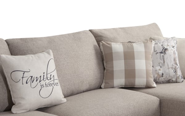 Beige Cottage Chic 150" 4-piece left arm facing sleeper chaise sectional with soft polyester fabric, decorative pillows, and traditional style upholstery.