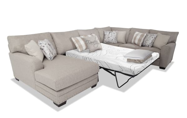 Cottage Chic Beige 4-piece right arm facing sleeper chaise sectional with queen Bob-O-Pedic cooling gel memory foam mattress, polyester fabric upholstery, traditional style, and nailhead trim.