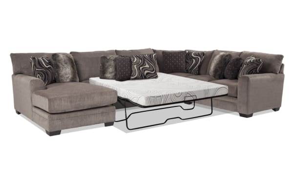 Luxe Gray 150'' 4 Piece Left Arm Facing Sleeper Chaise Sectional in transitional style with gray polyester fabric, gel memory foam queen cooling mattress, and patterned accent pillows.