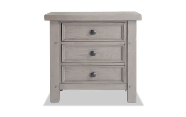 Hudson Gray 3 Drawer Nightstand in rustic transitional style with rubberwood, pine, and mango veneers. Features pewter-finish metal hardware.