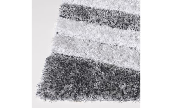 Contemporary 8' x 10' Gray Abstract Rug with plush polyester fabric, featuring gray and white geometric swirls and lines for modern home decor.