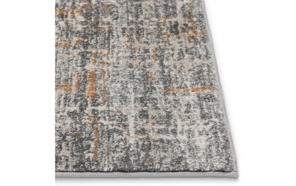 Griffith 5' x 8' Cement Abstract Rug in gray, white, and gold with a contemporary abstract pattern, made of durable polypropylene fabric.
