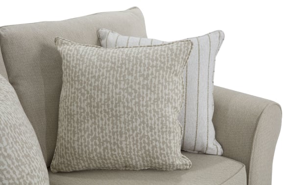 Beige Laurel 65'' transitional loveseat with rolled arms, polyester fabric upholstery, and four patterned accent pillows for cozy, stylish seating.