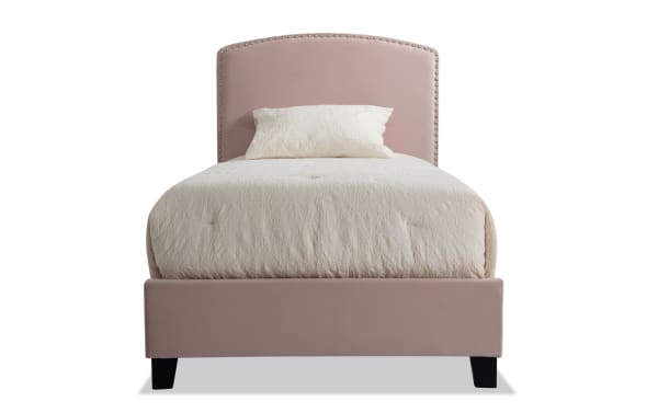Isabella Twin Pink Upholstered Panel Bed with arched nailhead-trimmed headboard, low footboard, and soft polyester fabric in transitional style.