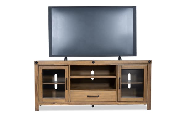 Sonoma 70'' natural rustic TV stand with acacia veneer, glass doors, cord management, open shelves, and center drawer for storage.