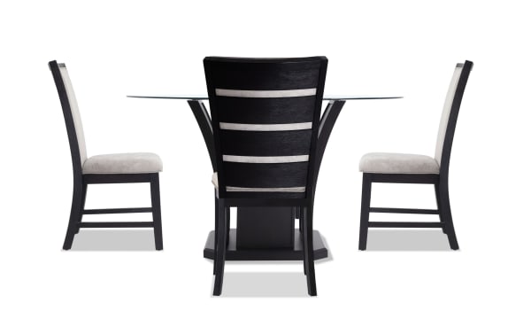 Cosmopolitan 5 Piece Black & Gray Upholstered Round Dining Set with velvet fabric chairs, tempered glass top, tulip-style base, and espresso wood finish.