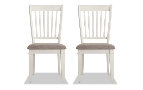Set of 2 Montana White & Beige Slat Back Upholstered Dining Chairs with rustic white rubberwood frame, beige polyester fabric, and memory foam seat.