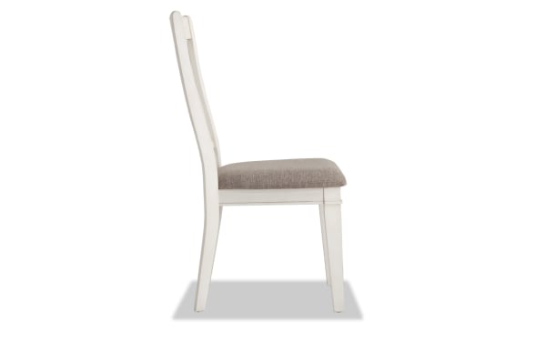 Montana White & Beige Slat Back Upholstered Dining Chair with rustic white rubberwood frame, beige polyester fabric seat, and memory foam cushion.