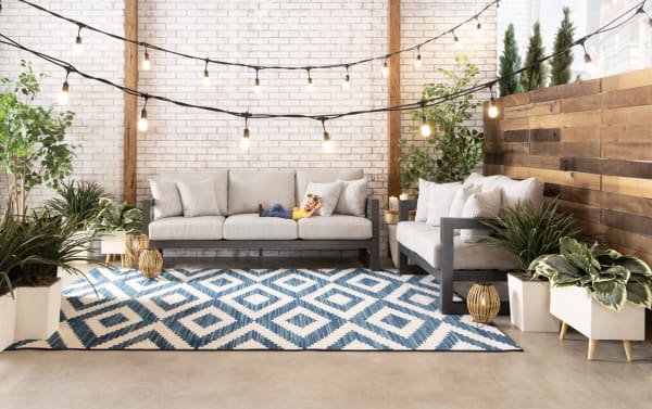 Contemporary Glam Gray Aluminum Outdoor Sofa with gray polyester fabric upholstery, rust-free powder-coated frame, memory foam cushions, and four accent pillows.