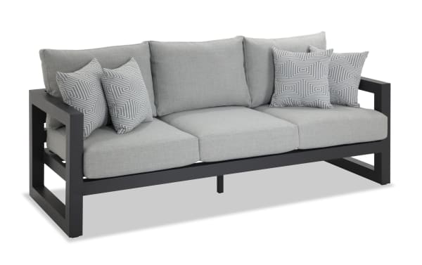 Glam Gray Aluminum Outdoor Sofa with contemporary gray polyester fabric cushions, rust-free powder-coated aluminum frame, and four patterned accent pillows from Glam Outdoor collection.