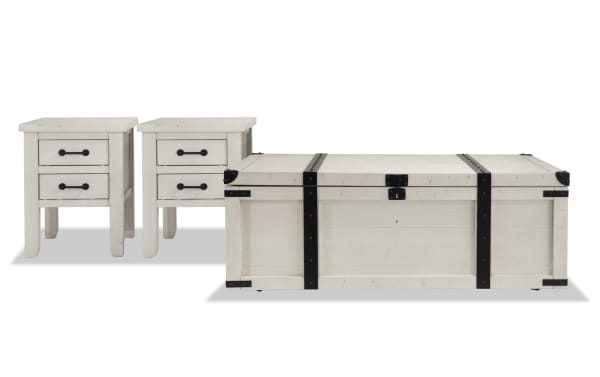Rustic Montana White Storage Trunk Coffee Table and 2 Chairside Tables set in distressed white wood with black hardware, USB ports, and power outlets.