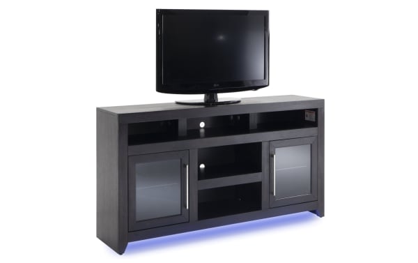 Cosmopolitan 65" black acacia veneer TV stand with glass doors, silver hardware, adjustable shelves, soundbar space, and blue LED lighting.