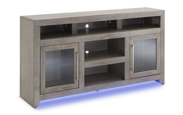 Cosmopolitan 65'' gray MDF and acacia veneer TV stand with glass doors, silver hardware, adjustable shelves, soundbar space, and blue LED lighting.