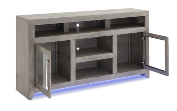 Cosmopolitan 65'' gray contemporary TV stand with MDF/acacia veneer, glass doors, silver hardware, adjustable shelves, soundbar space, and blue LED lighting.
