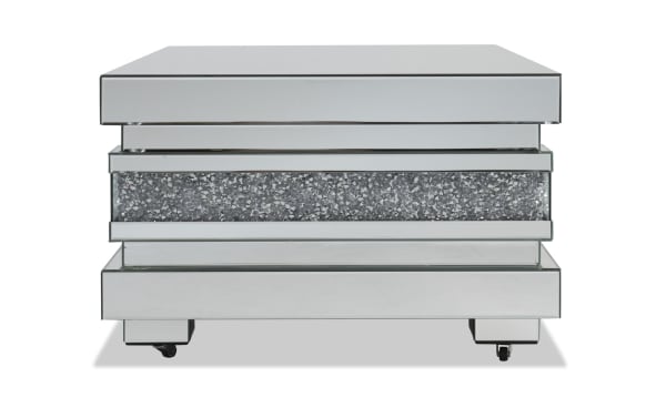 Glamour Silver Mirrored Coffee Table from Glamour Entertainment & Occasional collection, featuring silver mirrored MDF, tempered glass, faux crushed crystal inlay, beveled edges, and open shelving for stylish living room decor.