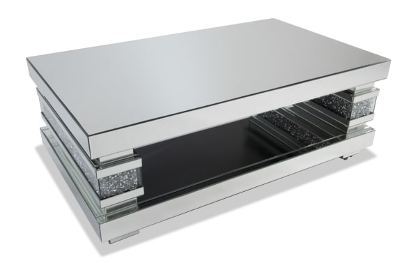 Glamour Silver Mirrored Coffee Table from Glamour Entertainment & Occasional collection, featuring a silver mirrored MDF and tempered glass design with faux crushed crystal inlay, beveled edges, and open shelving for stylish living room accent.