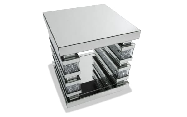Glamour Silver Mirrored End Table from Glamour Entertainment & Occasional collection, featuring silver MDF, tempered glass, beveled edges, and faux crushed crystal inlay with open shelving for stylish living room accent.