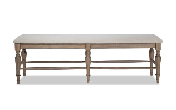 Cottage Chic Light Brown & Beige Upholstered Dining Bench with weathered wood frame, beige polyester fabric seat, and traditional farmhouse style.