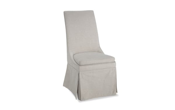 Cottage Chic Cream solid back upholstered dining chair with polyester fabric, skirted design, and weathered wood finish in farmhouse style.