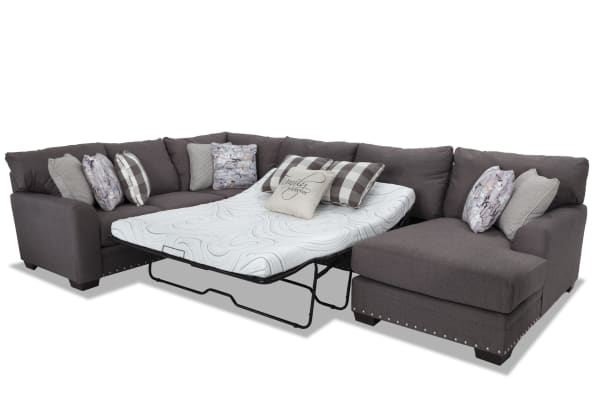 Cottage Chic Gray 4-piece right arm facing sleeper chaise sectional with queen cooling gel memory foam mattress, gray polyester fabric, traditional style, nailhead accents, and multiple accent pillows.