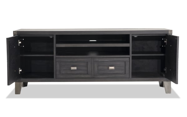 Wentworth 64'' black transitional TV stand with poplar solids, MDF, metal legs, two open shelves, two drawers, and two side cabinets for storage.