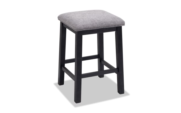 Contemporary Elevations Black & Gray backless bar stool with gray polyester fabric seat, acacia wood frame, and wire-brushed finish for dining or sofa table.