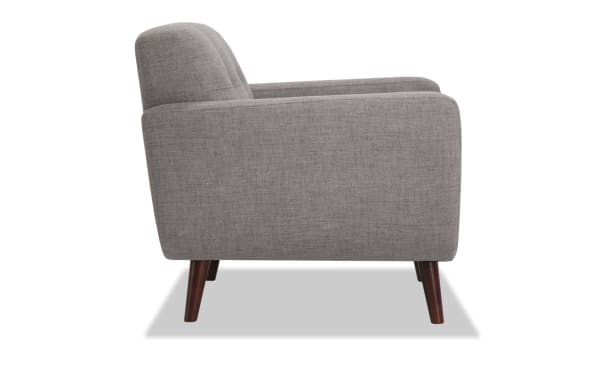 Mid-century modern Bettie Gray Chair with gray polyester fabric upholstery, tufted seat back, track arms, and tapered wooden legs.