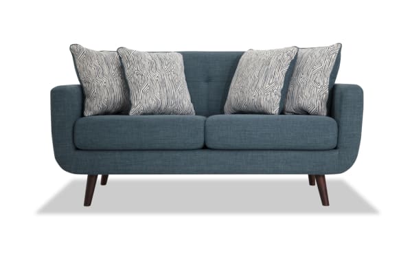 Mid-century modern Bettie Teal 65'' Loveseat in blue polyester fabric with tufted back, four patterned accent pillows, track arms, and wooden legs.