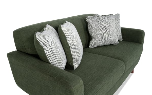 Bettie Avocado 65'' Loveseat in mid-century modern style with avocado green 100% polyester fabric, tufted back, track arms, wooden legs, and four patterned accent pillows.