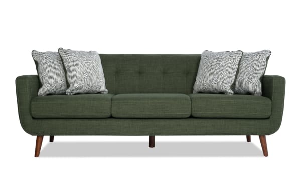 Bettie Avocado 86'' Sofa in green polyester fabric with mid-century modern tufted back, track arms, wooden legs, and four patterned accent pillows.